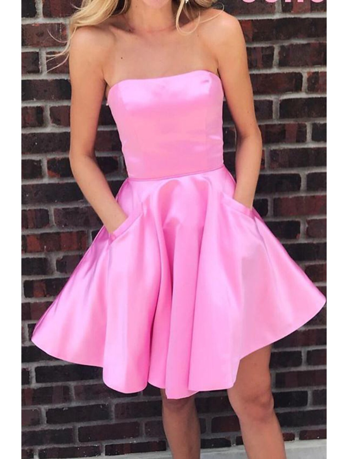 Back view of the elegant A-line strapless pleated satin short mini cocktail dress.