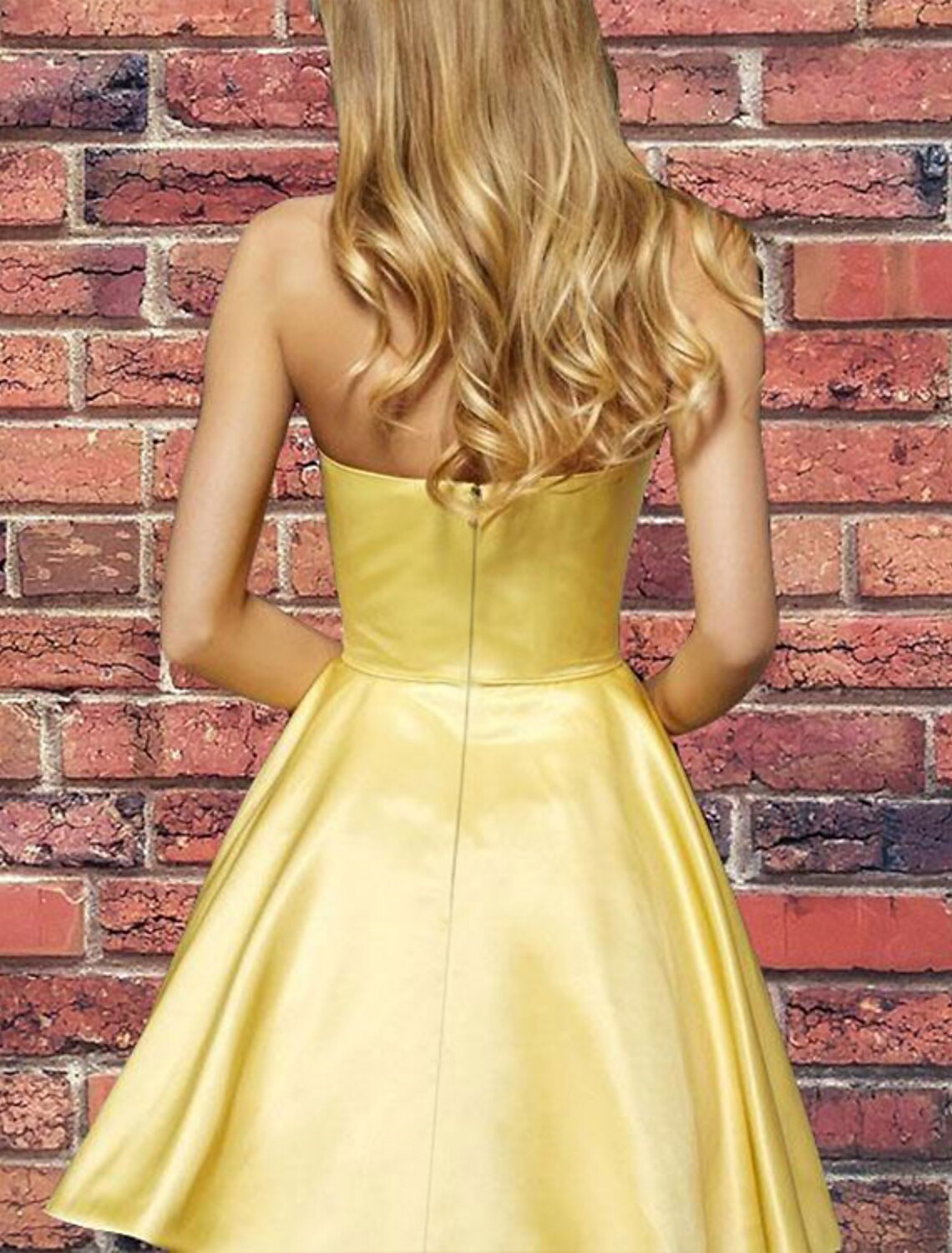 Close-up of the pleated satin fabric on the short mini homecoming dress.