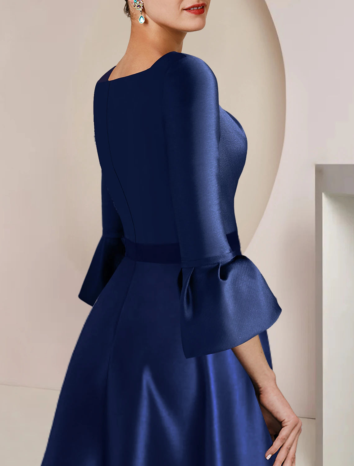 Elegant A-Line Bateau Neck 3/4 Sleeve Satin Tea Length Dress, side view on model.