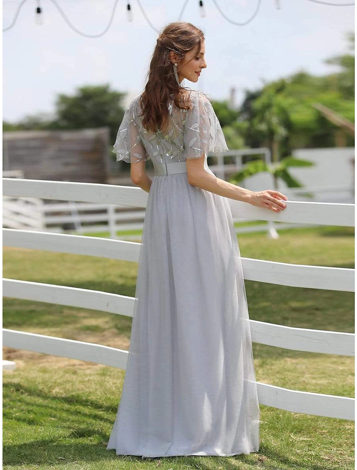 Back view of the floor-length A-Line Empire prom dress.