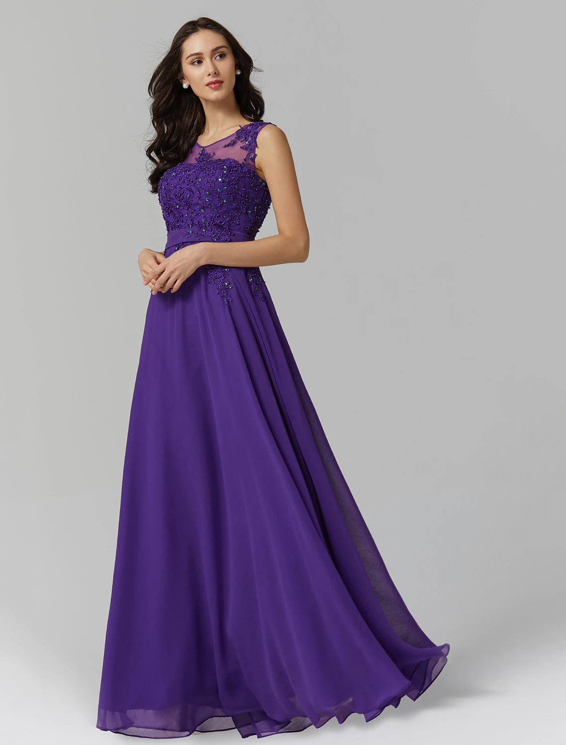 Back view of A-Line chiffon dress showing V-back and appliques.