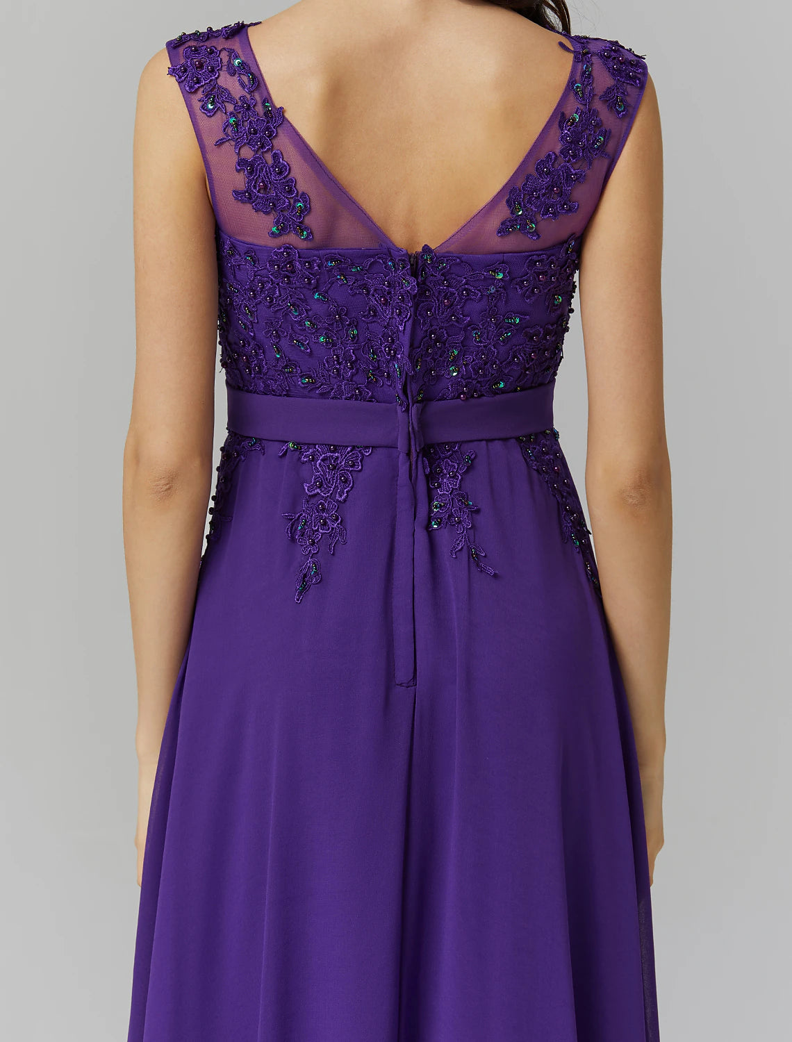 Close-up of beaded appliques on the bodice of the formal dress.