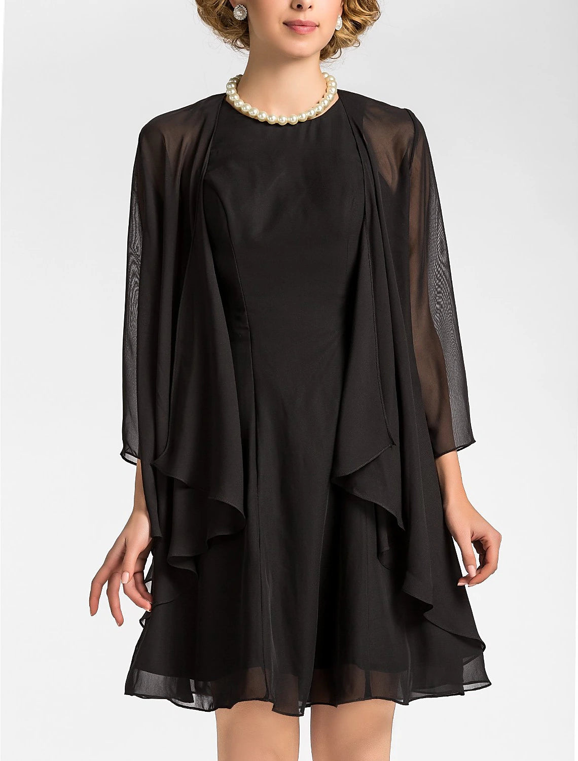 Close-up of the jewel neck and 3/4 sleeve detail on the elegant chiffon dress.
