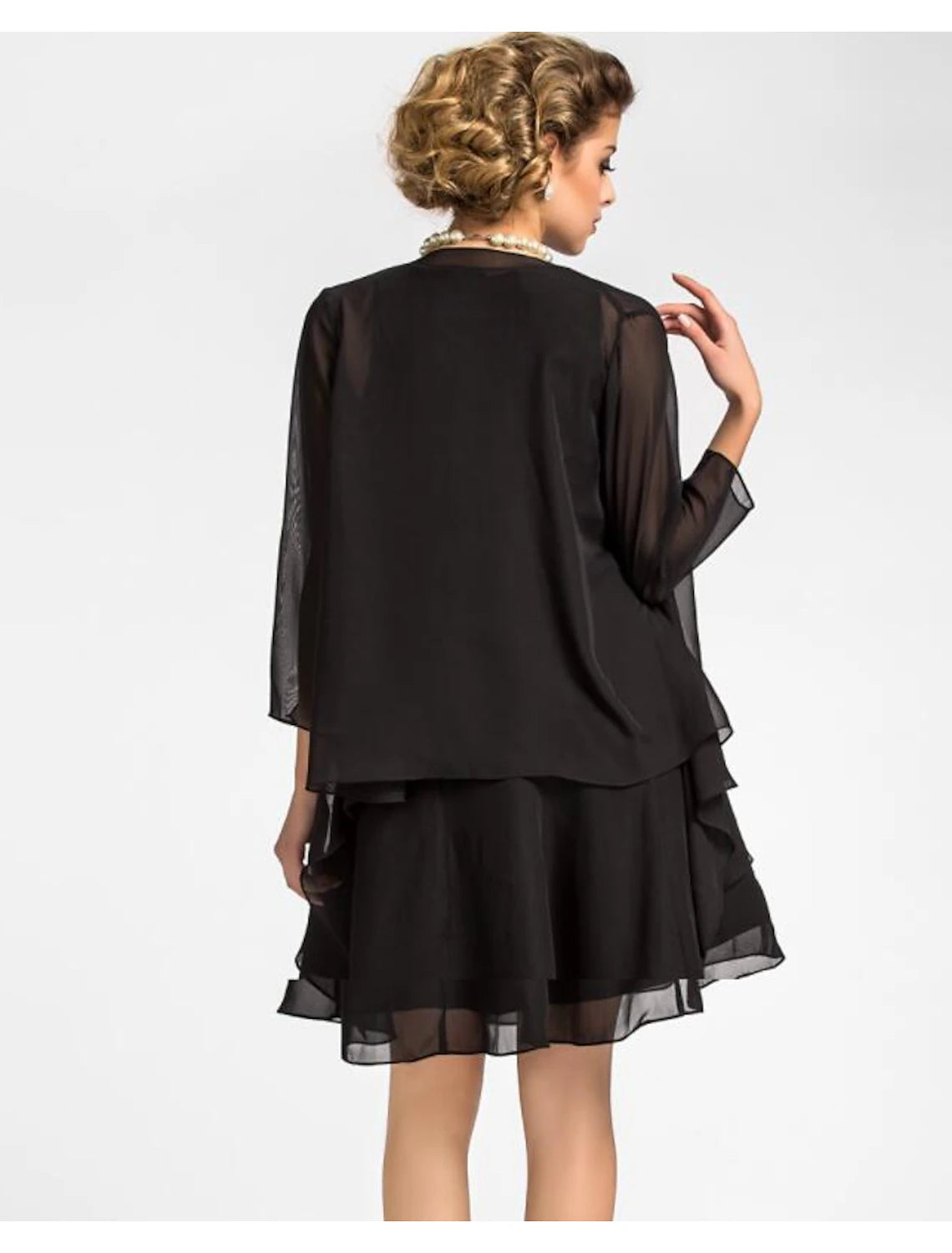 Mother of the Bride dress with wrap draped over shoulders, elegant and refined.