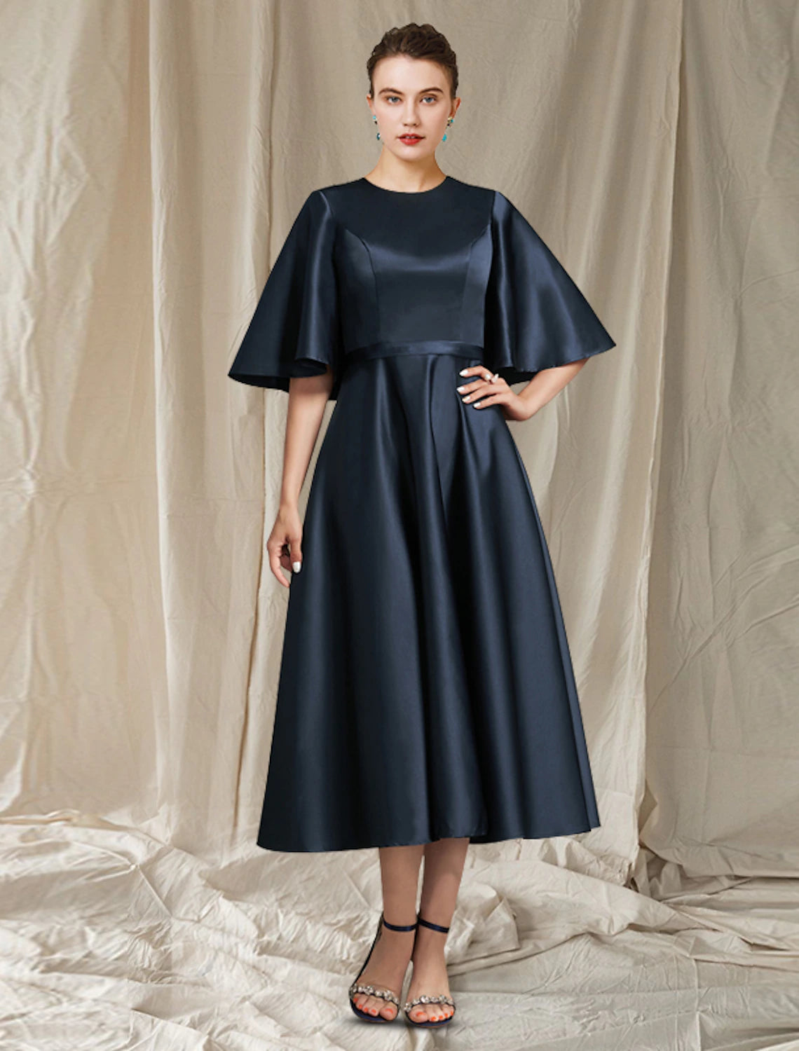 Elegant A-Line pleated satin dress with jewel neck and half sleeves.