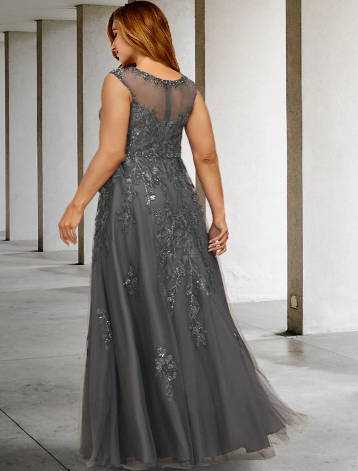 Back view of a floor-length plus size mother of the bride dress with sequin appliques.