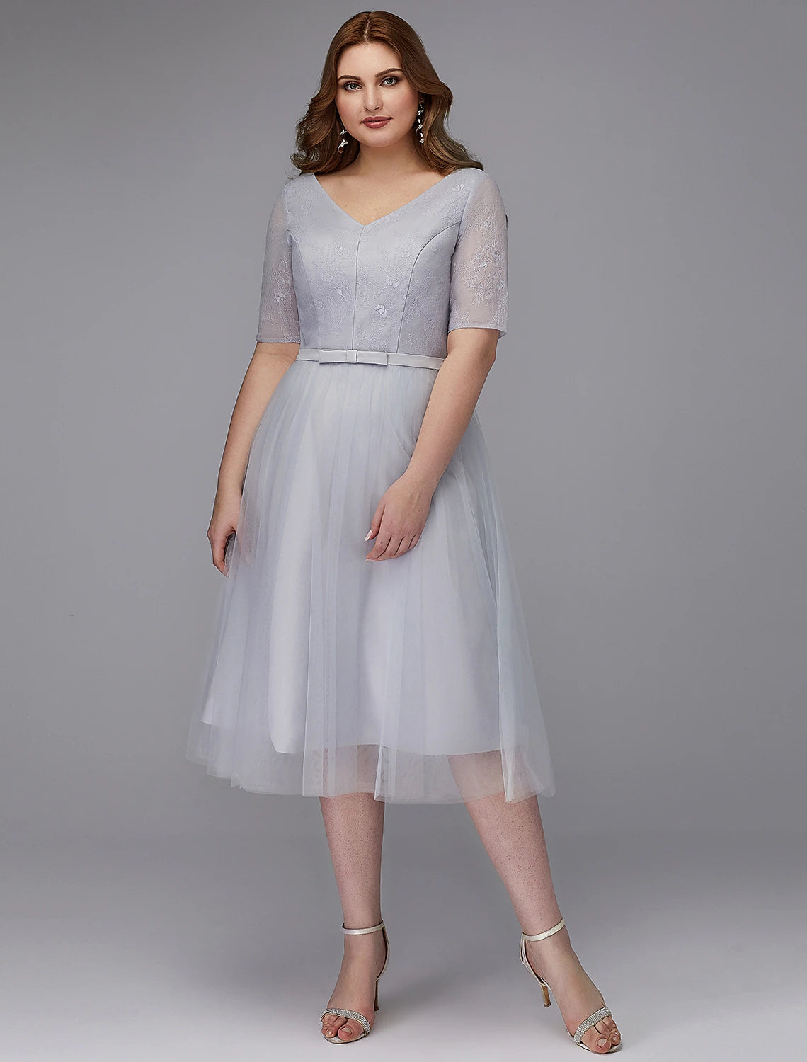 Elegant A-Line Lace V-Neck Short Sleeve Tea Length Cocktail Dress.