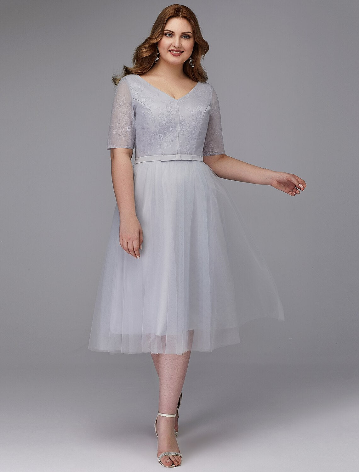 Elegant A-Line Lace V-Neck Short Sleeve Tea Length Cocktail Dress.