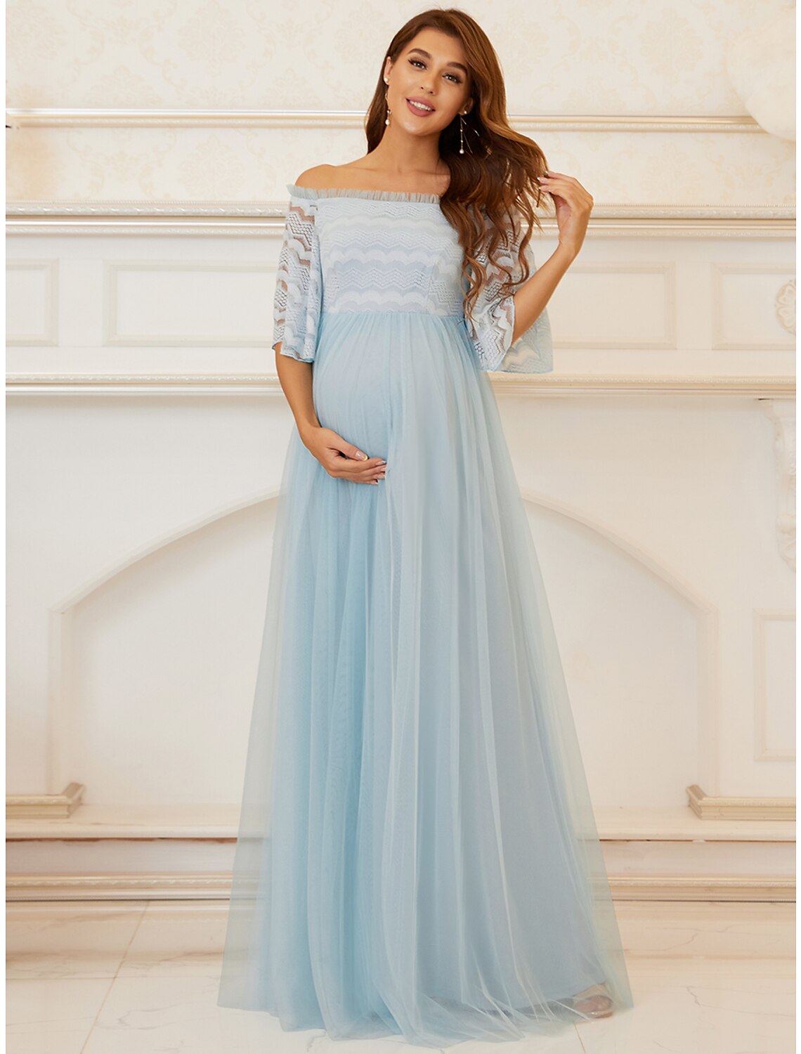 Full view of the graceful A-line off-shoulder formal dress.