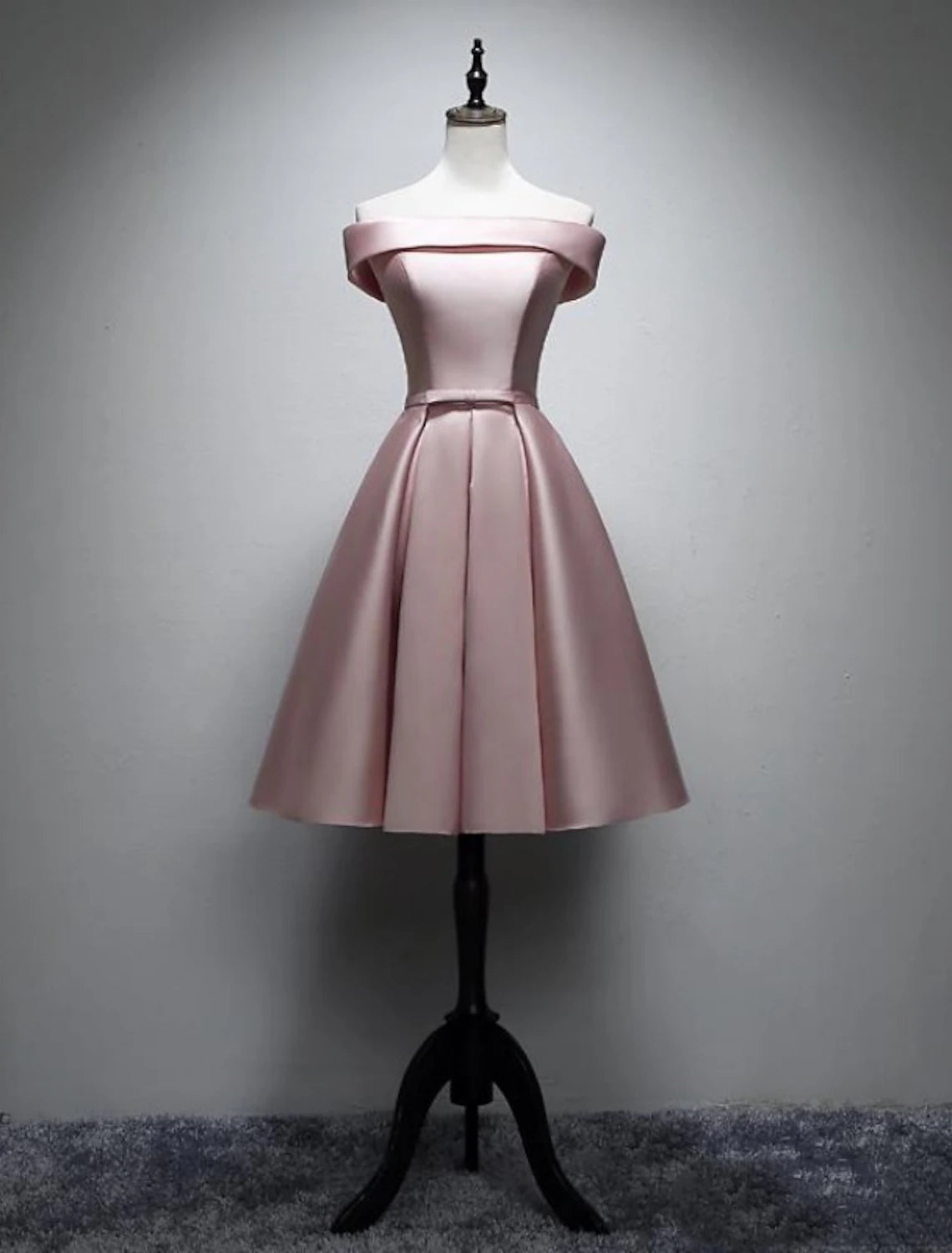 Elegant A-line off-shoulder satin bridesmaid dress with bows and pleats.