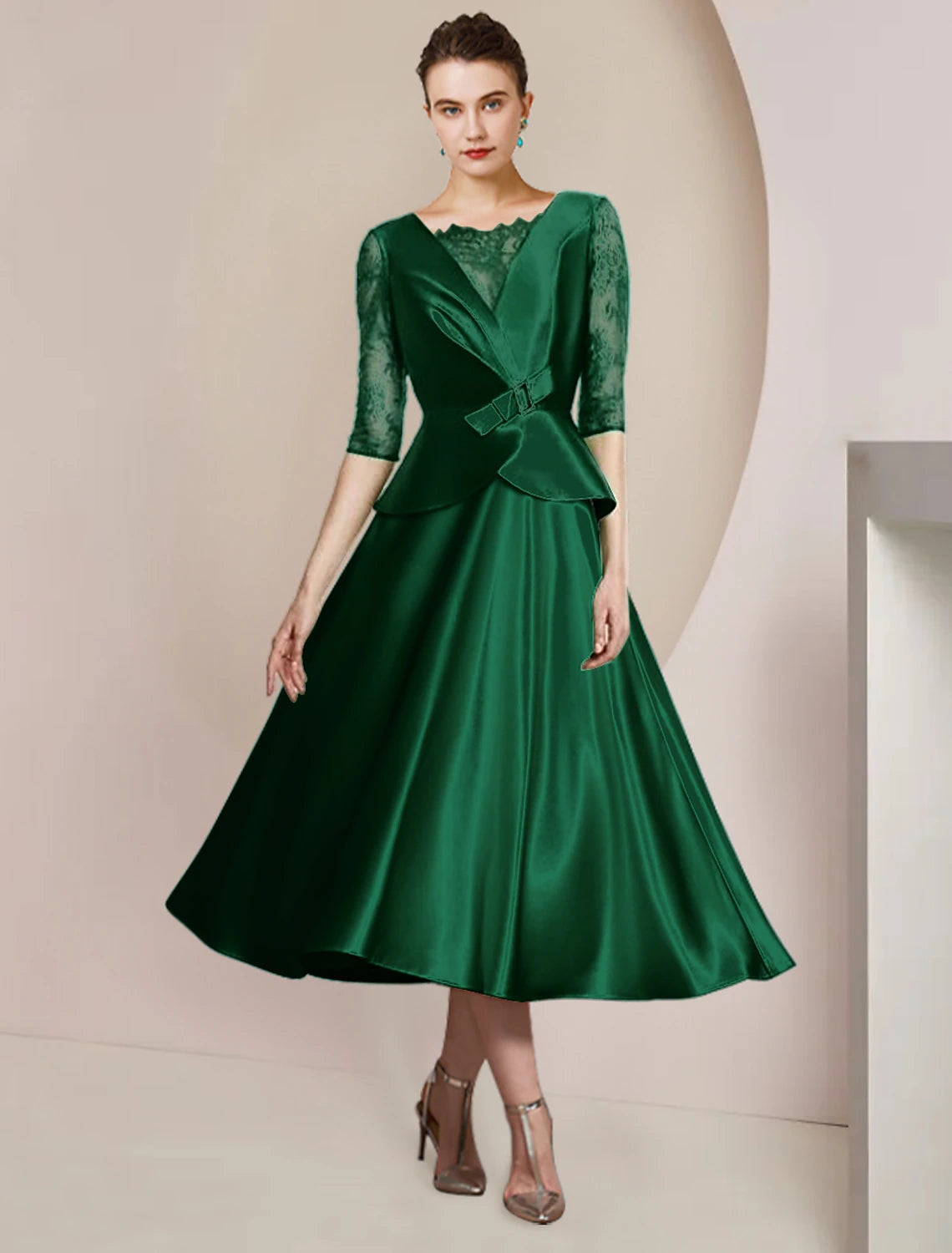 Elegant A-Line Mother of the Bride dress in satin and lace with scoop neck and half sleeves.