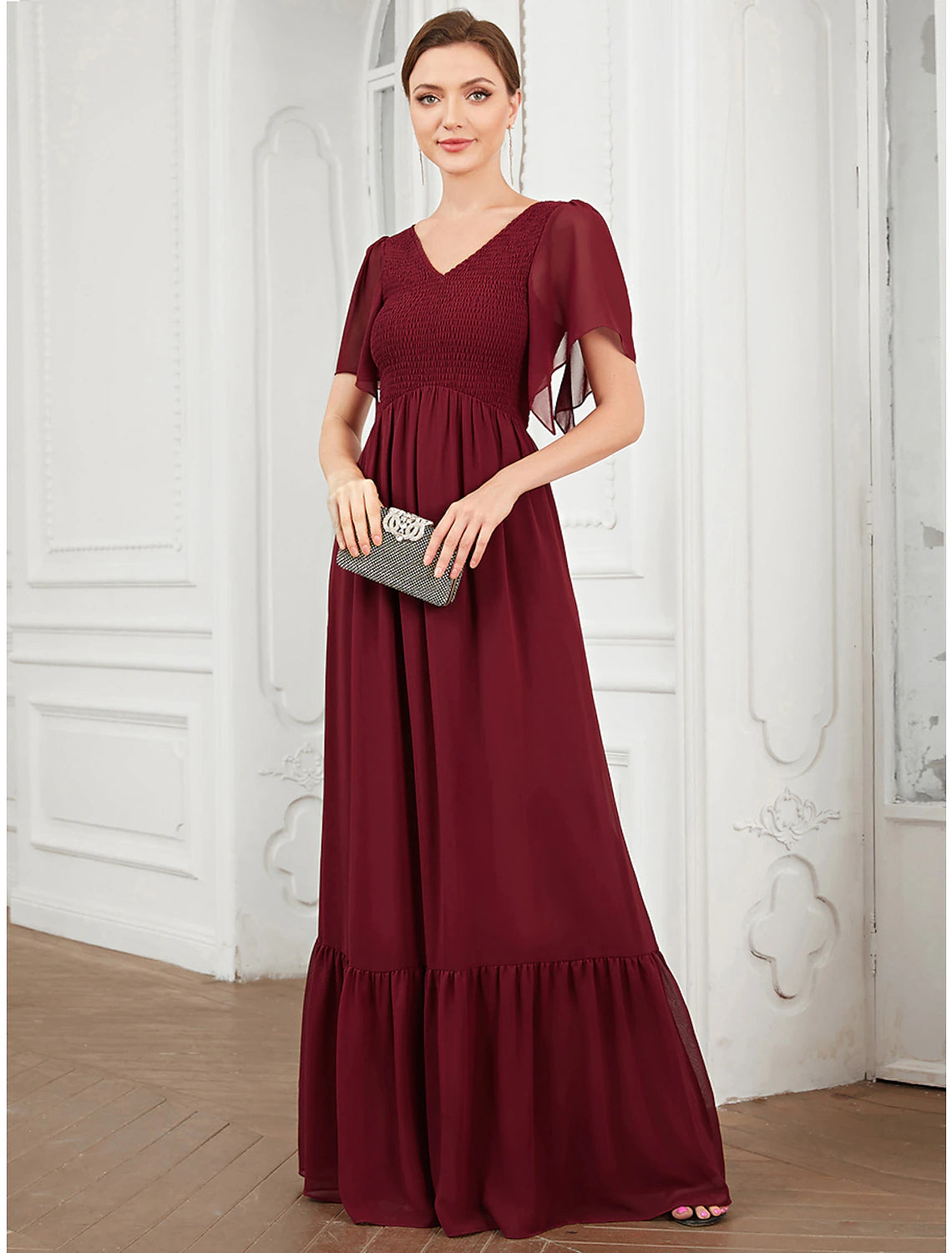 Model wearing a blue A-Line V-Neck short sleeve pleated chiffon prom dress.