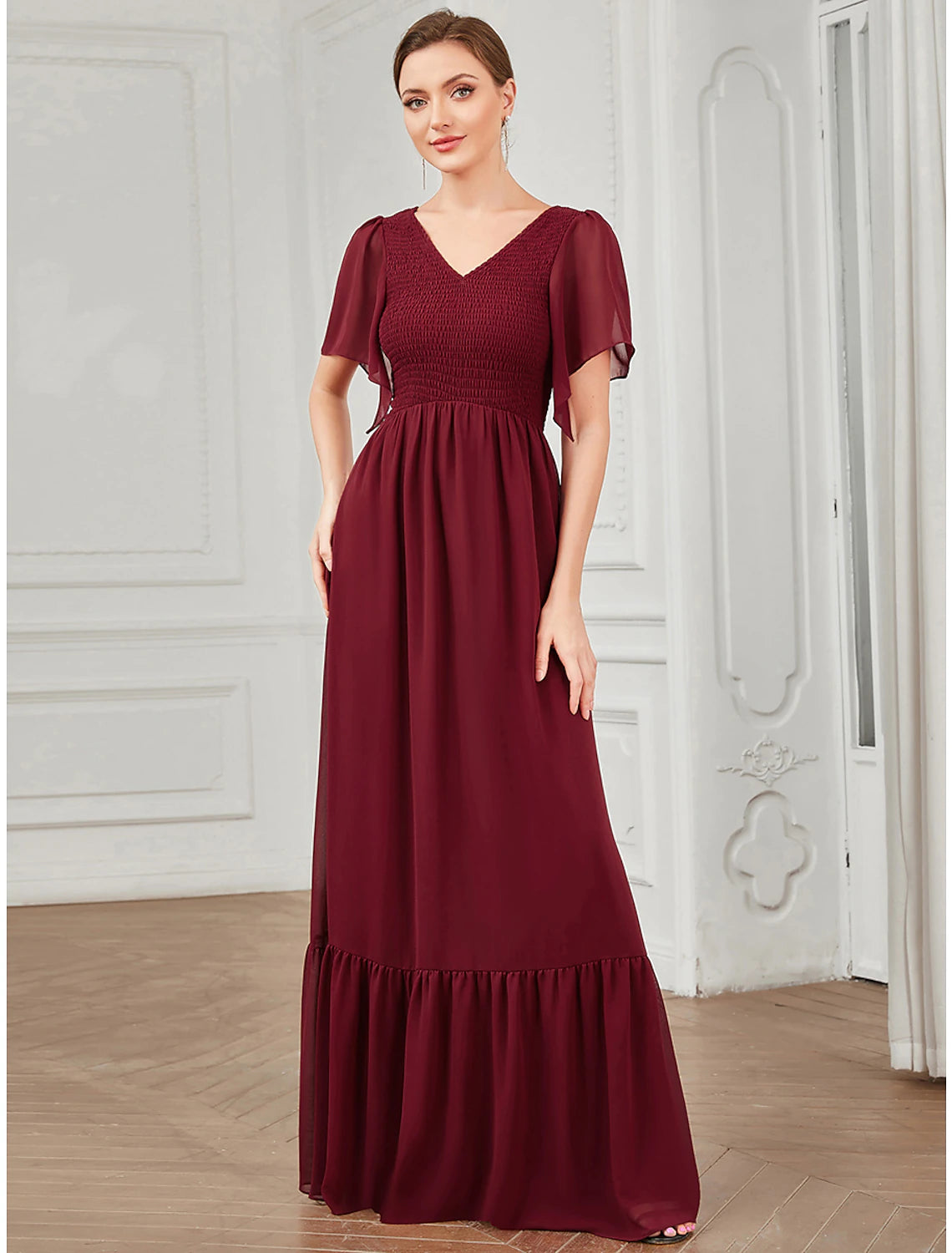 Model in a pink A-Line V-Neck short sleeve pleated chiffon dress, side view.