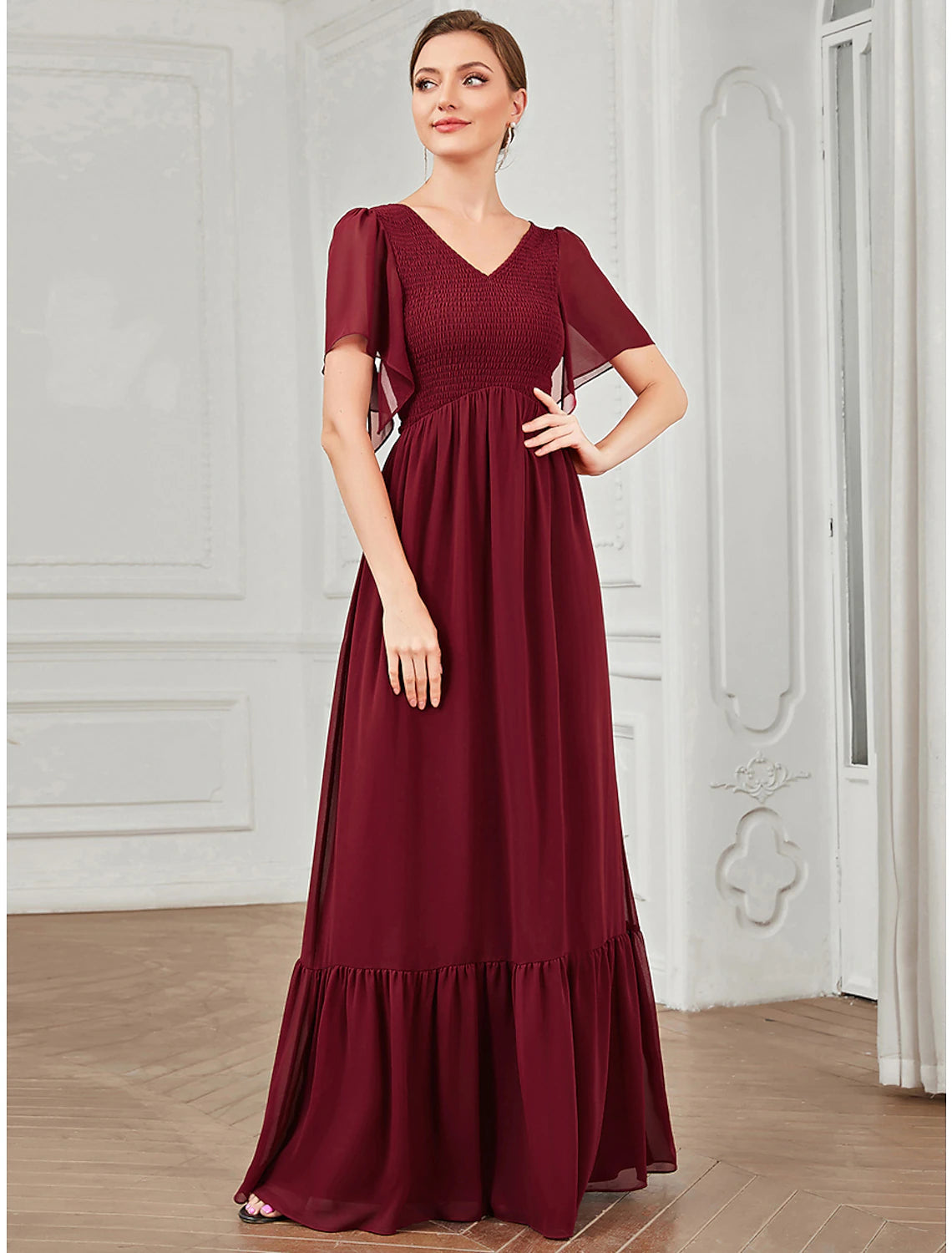 Model in a purple A-Line V-Neck short sleeve pleated chiffon dress, back view.