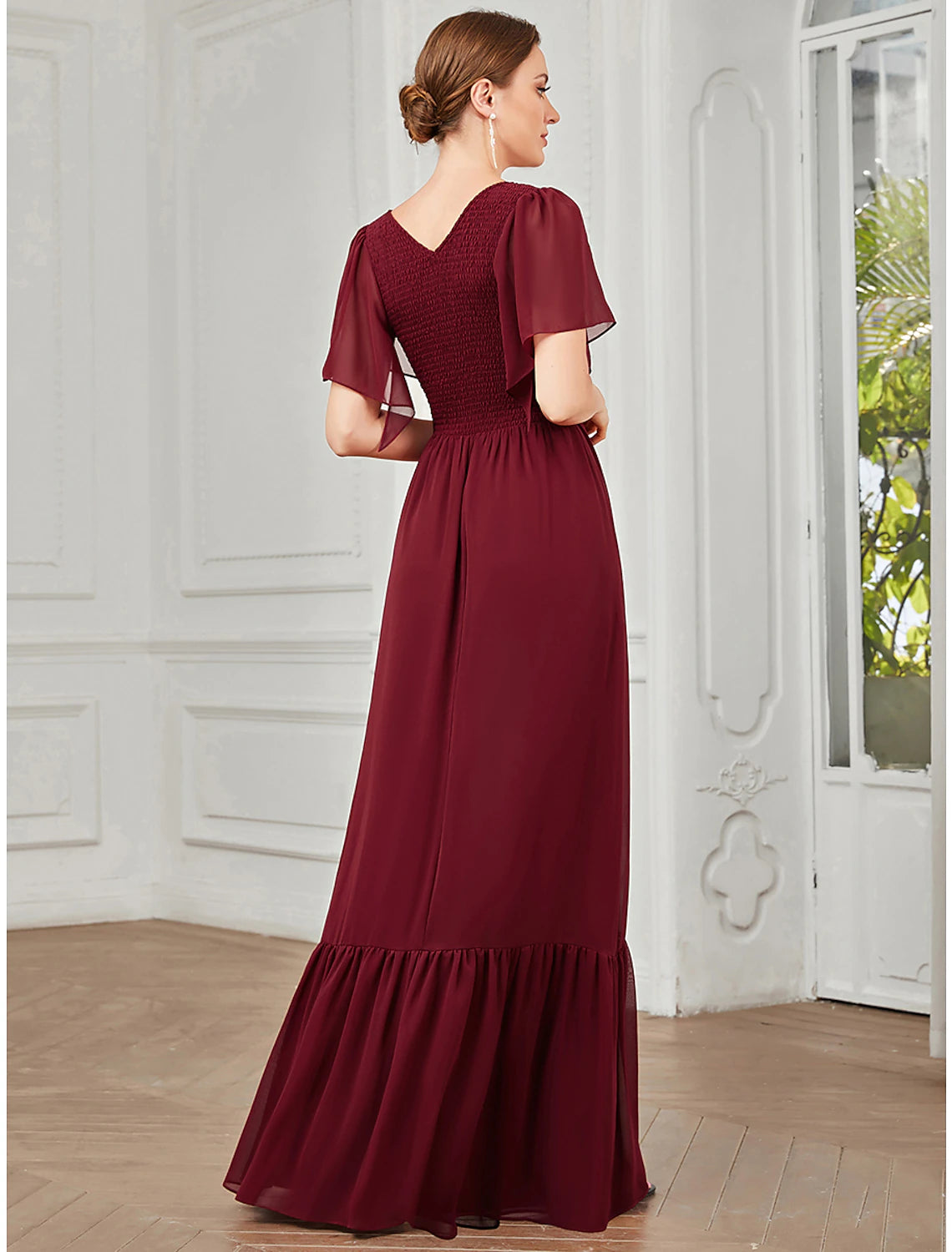 Model posing in a green A-Line V-Neck short sleeve chiffon prom dress.