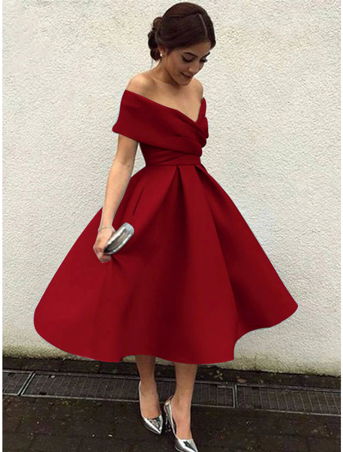 Close-up of the V-neckline and short sleeves on the elegant cocktail dress.