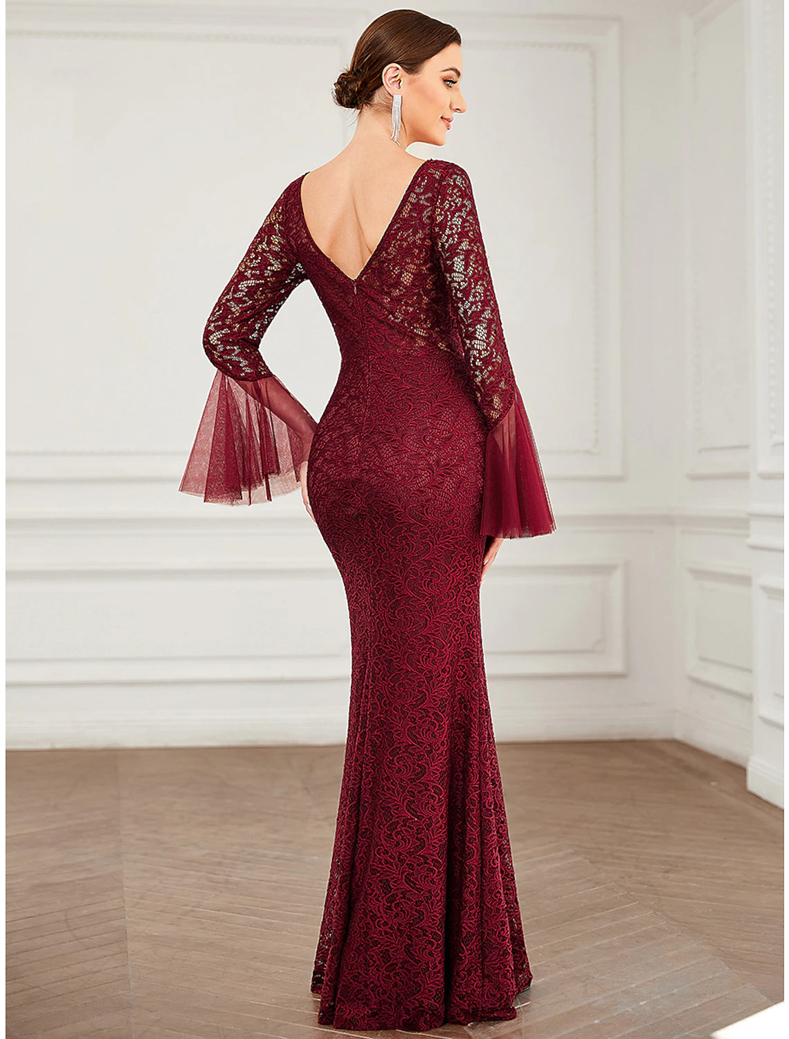 Jewel neck and lace sleeve detail on the elegant formal dress.