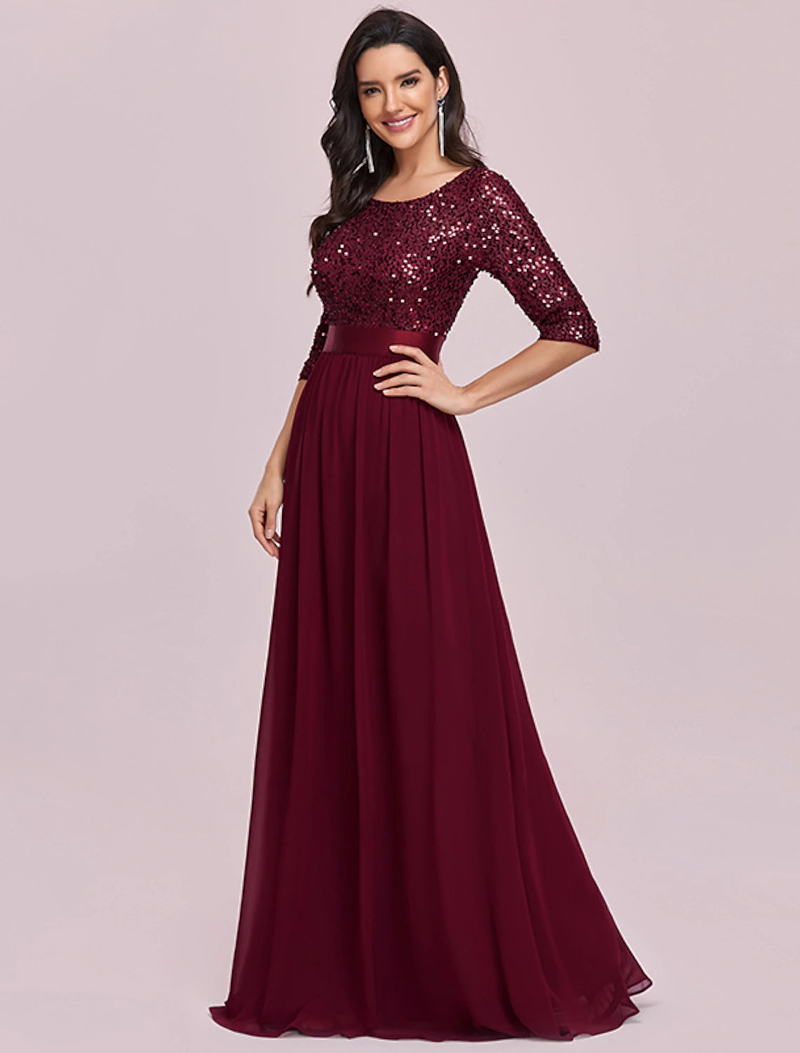 Back view of the elegant plus size A-line jewel neck sequined tulle gown.