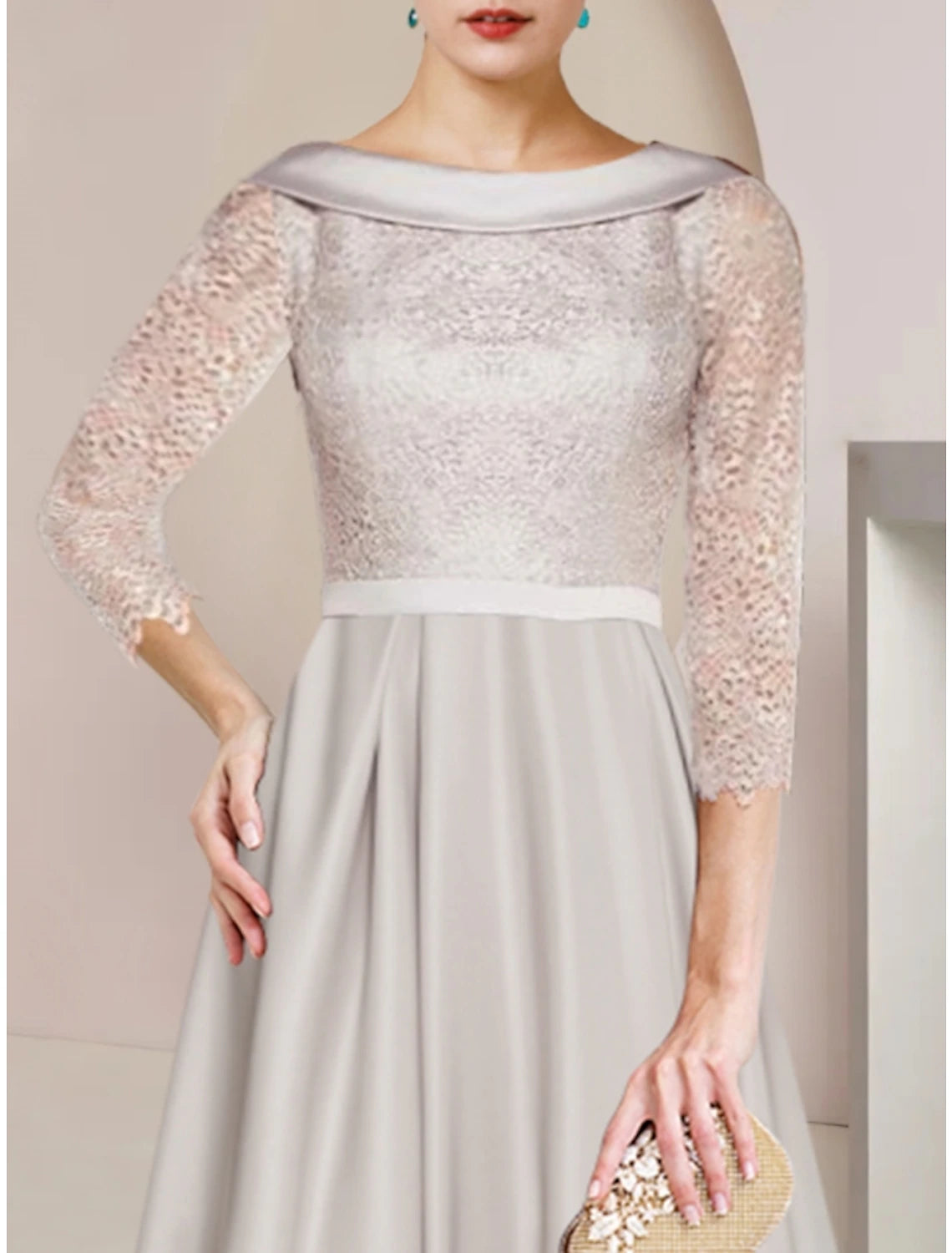 Front view of an elegant sheath mother of the bride dress with lace half sleeves.