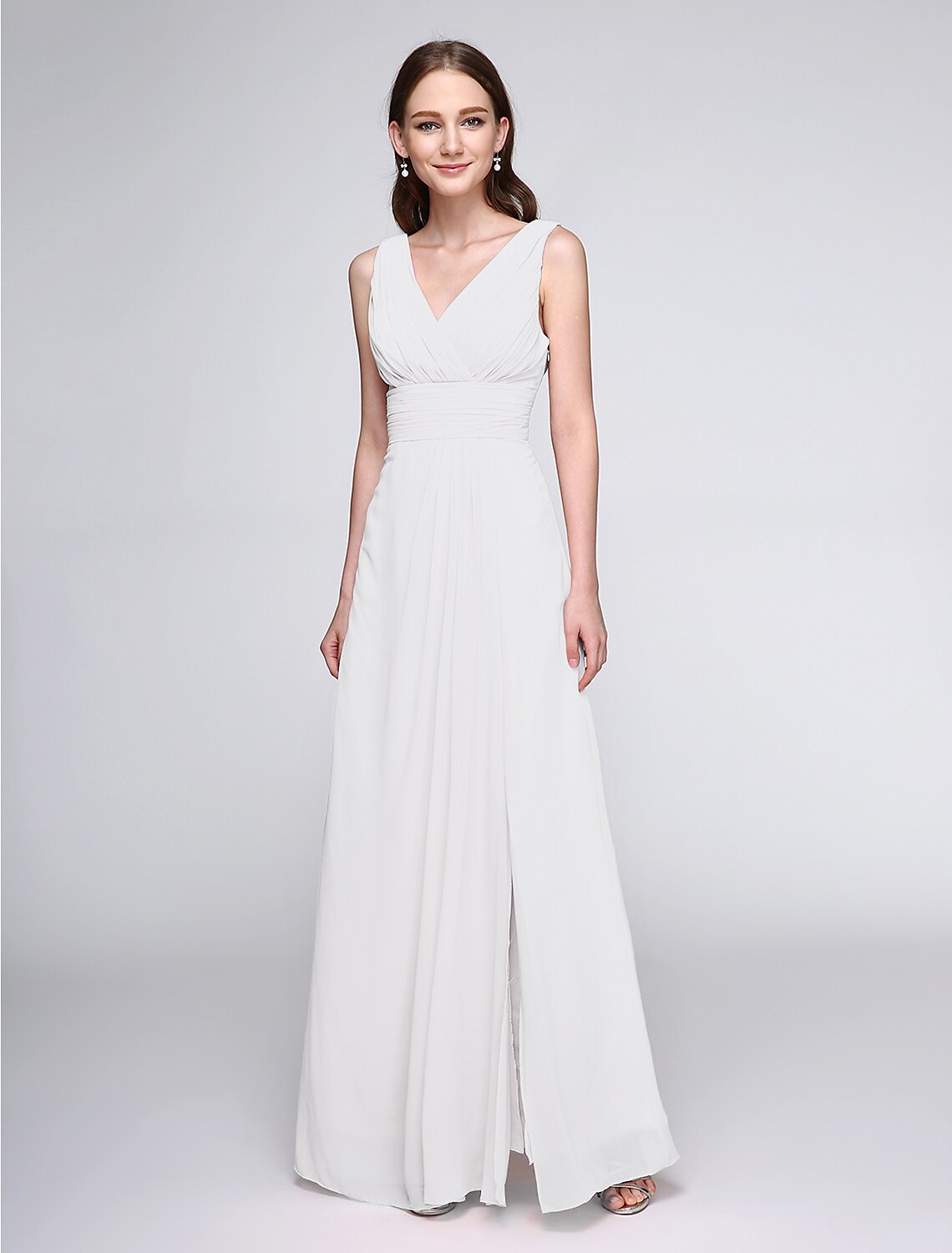 Back view of a model wearing a floor-length V-neck ruched chiffon bridesmaid dress.
