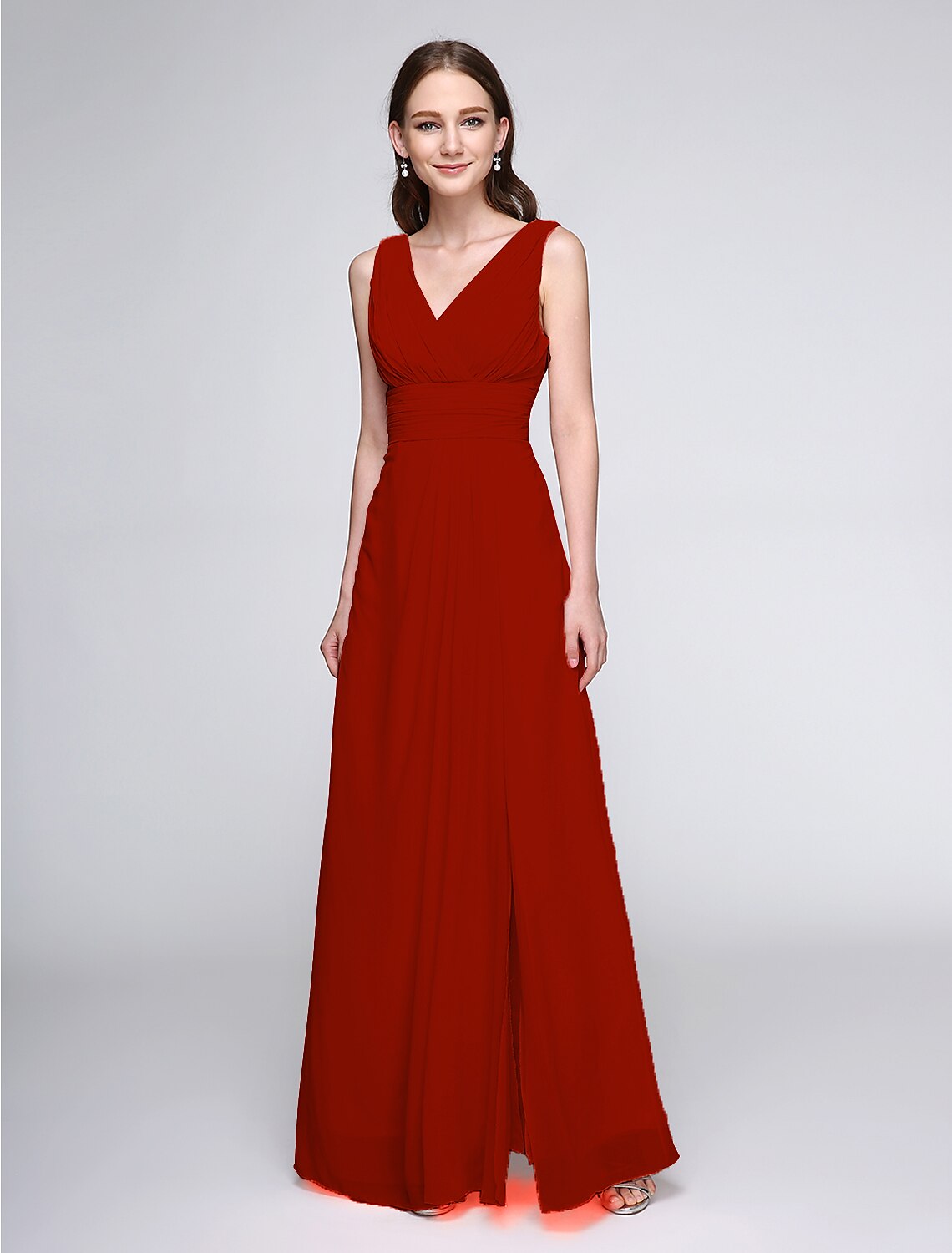 Full-length view of a model in a flowing V-neck sheath chiffon bridesmaid dress.