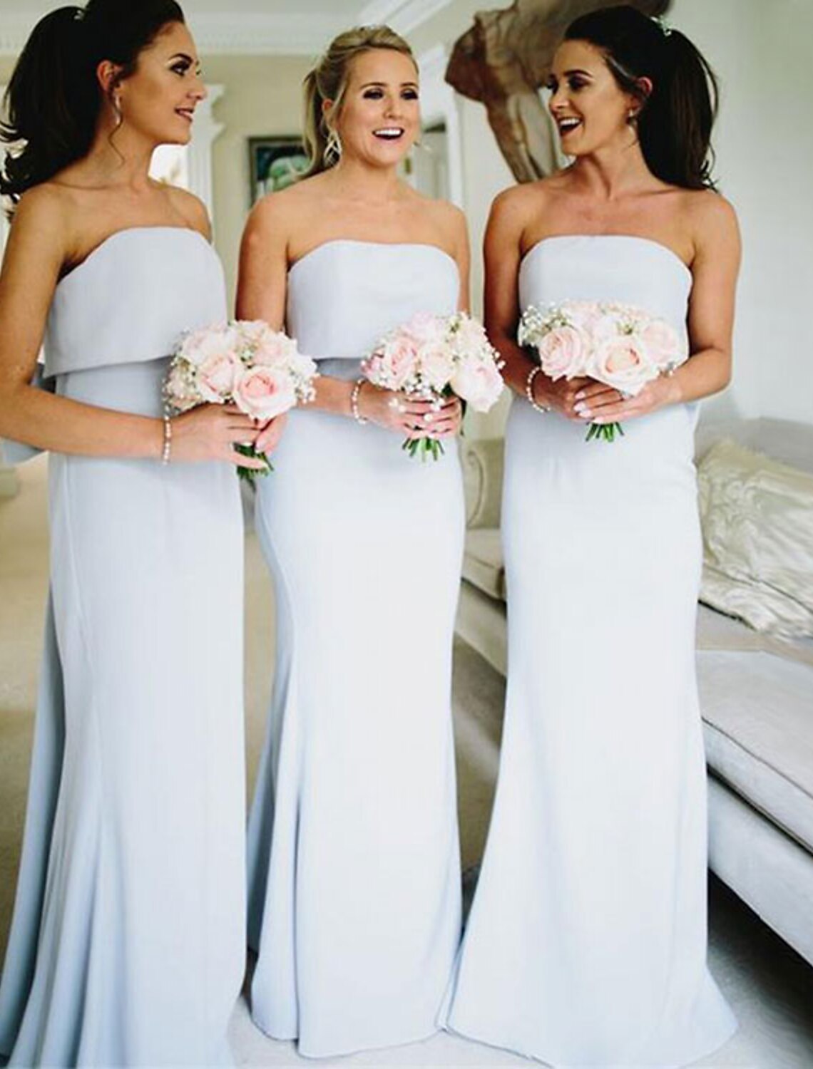 Elegant Strapless Mermaid Trumpet Bridesmaid Dress with Bows and Ruffles.