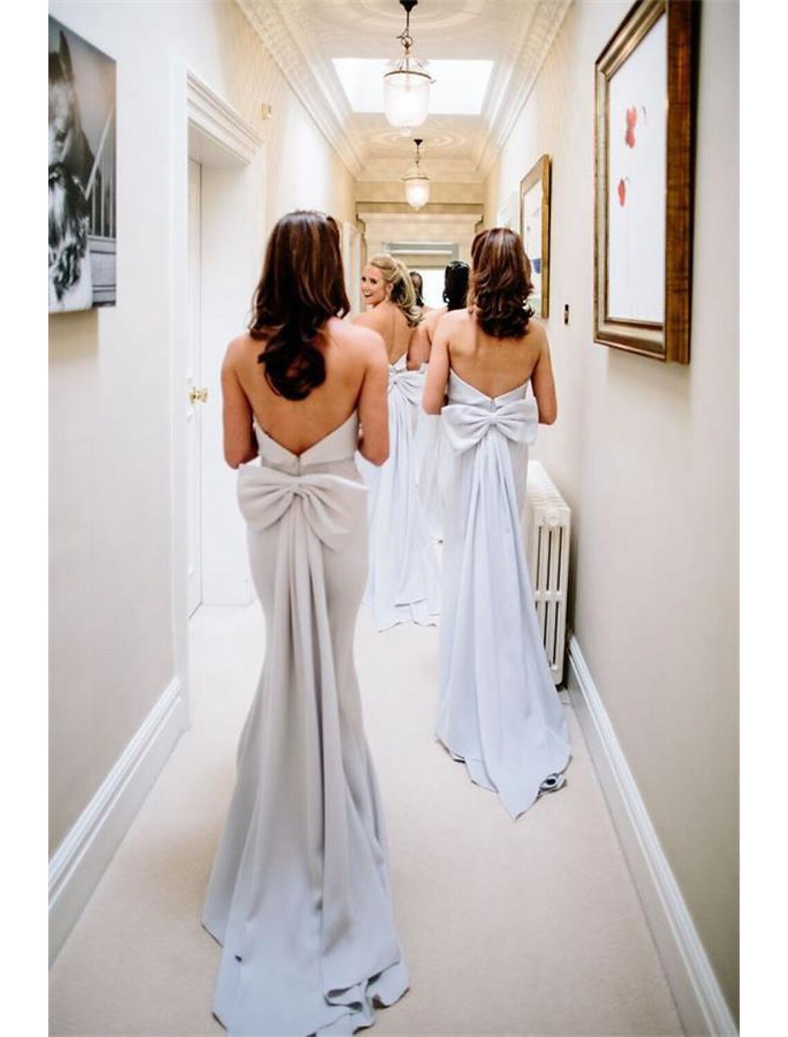 Elegant Strapless Mermaid Trumpet Bridesmaid Dress with Bows and Ruffles.