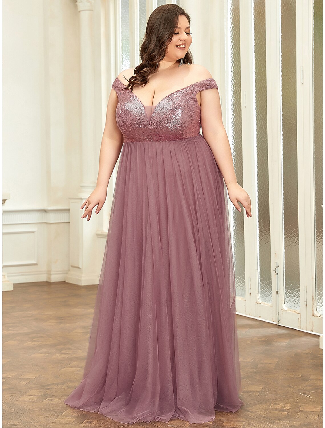 Back view of an elegant V-neck sleeveless floor-length bridesmaid dress.