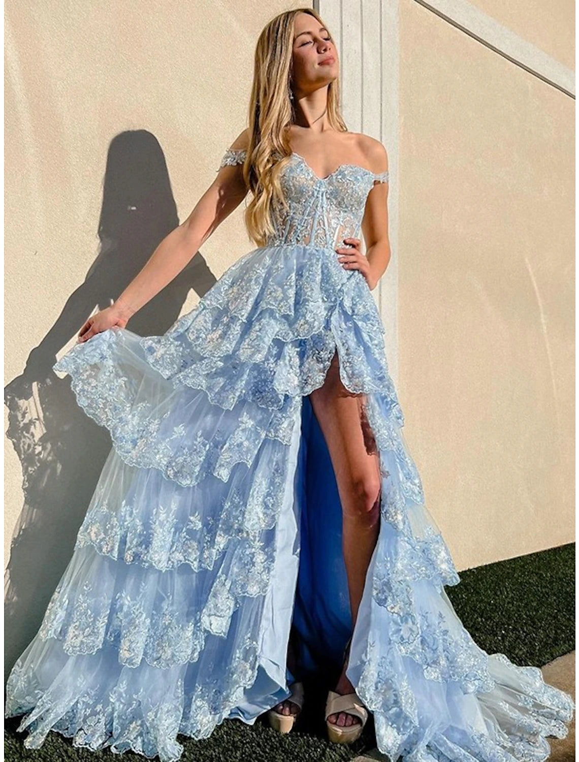 Glamorous mermaid trumpet prom gown with off-shoulder neckline.