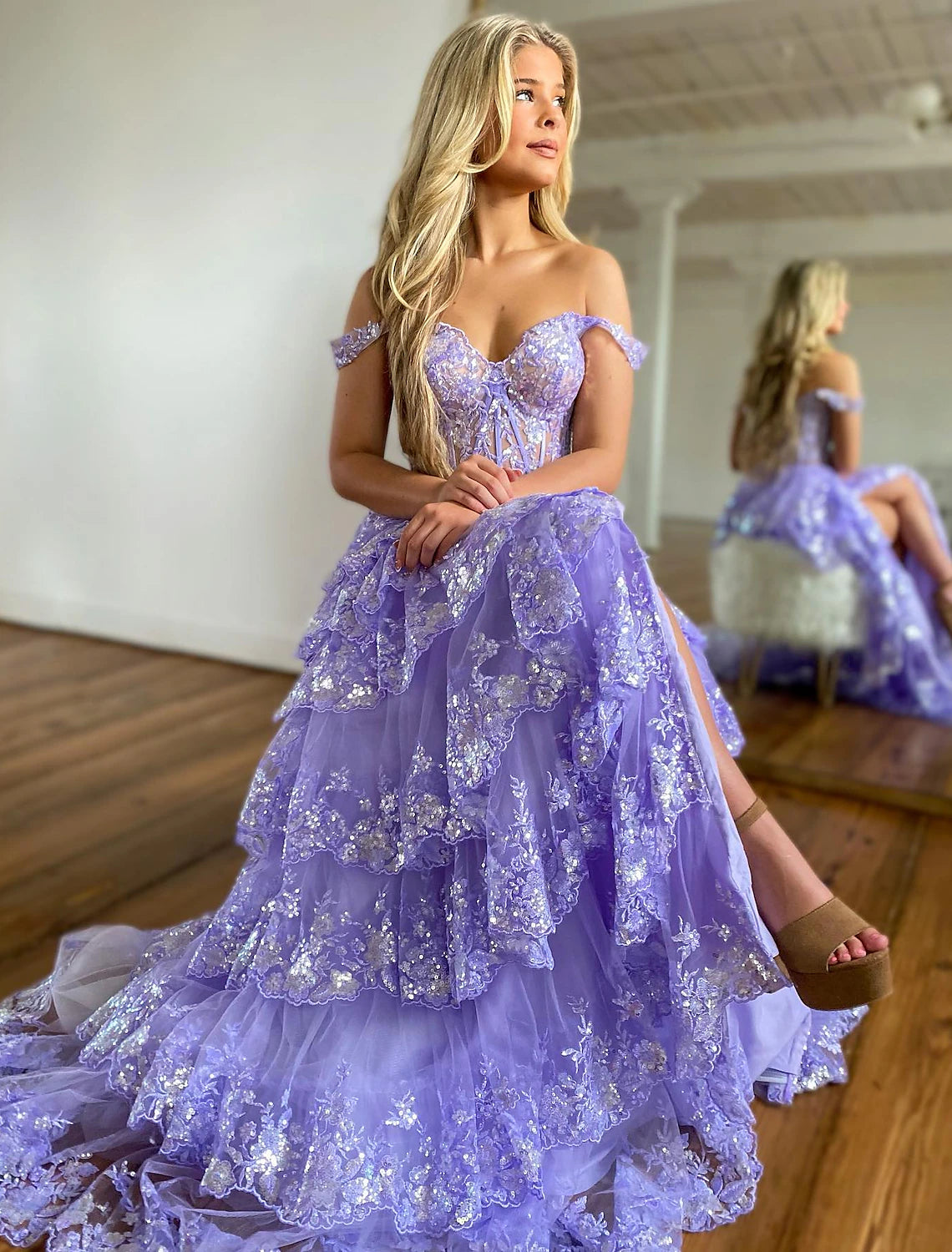 Elegant off-shoulder mermaid trumpet evening dress with sequin slit.
