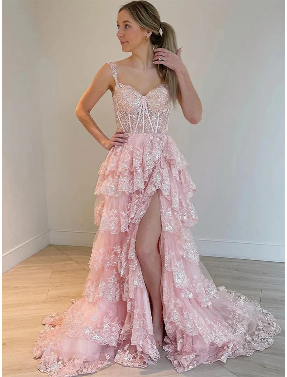 Stunning sequined mermaid trumpet gown featuring a court train.