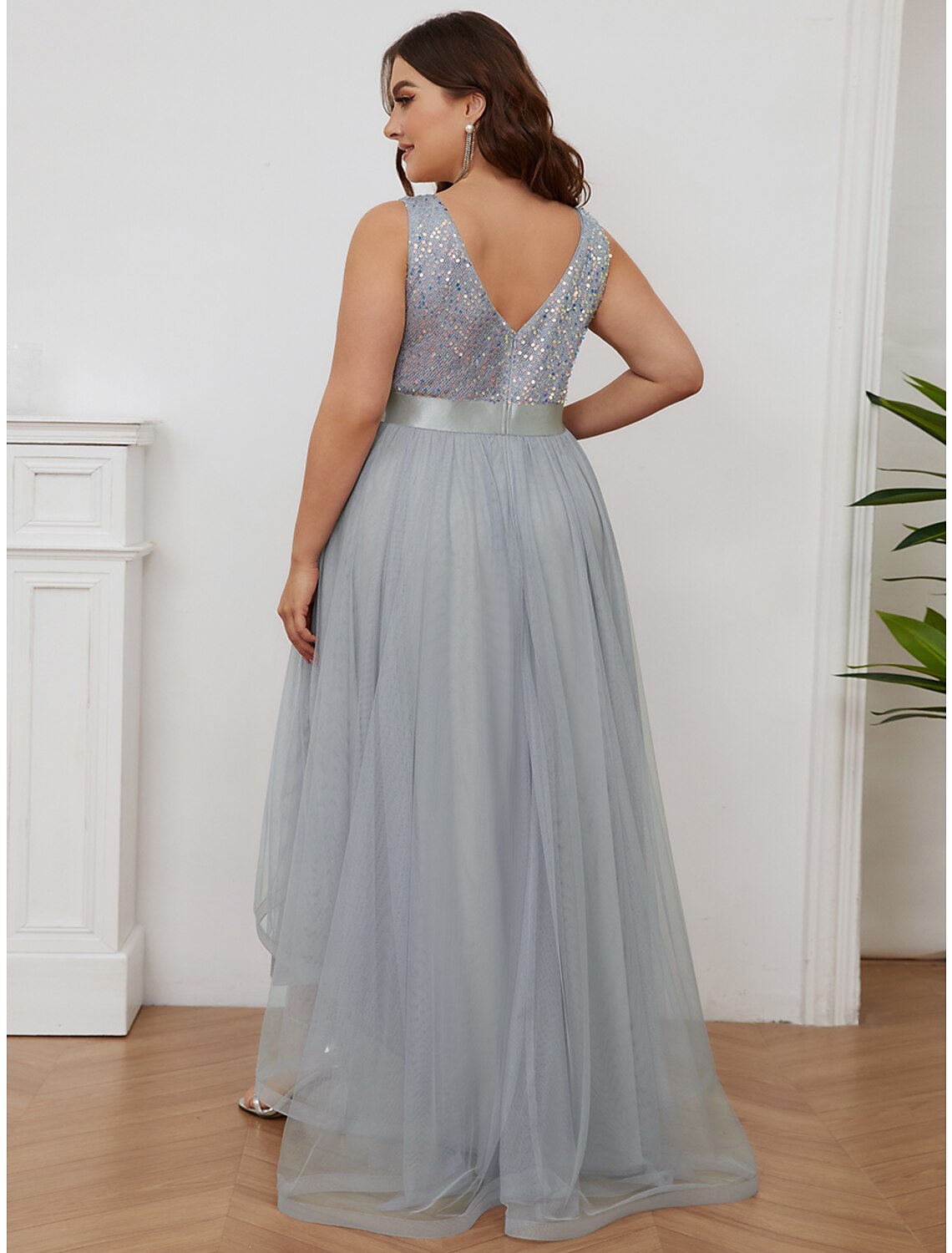 Close-up of the sequin and tiered details on the champagne maxi bridesmaid gown.