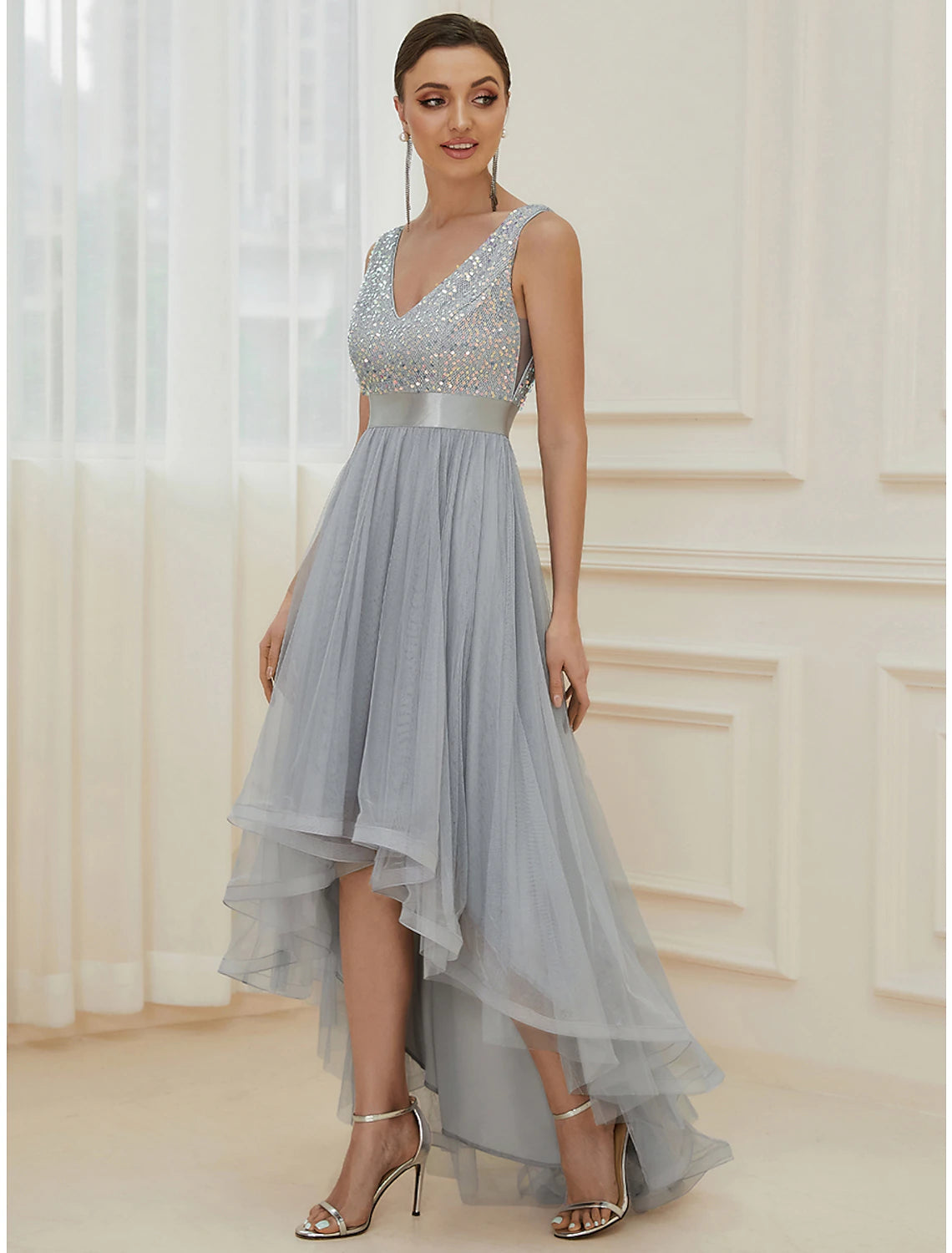 Side view of a sparkling A-line V-neck sequin tiered champagne maxi bridesmaid gown.