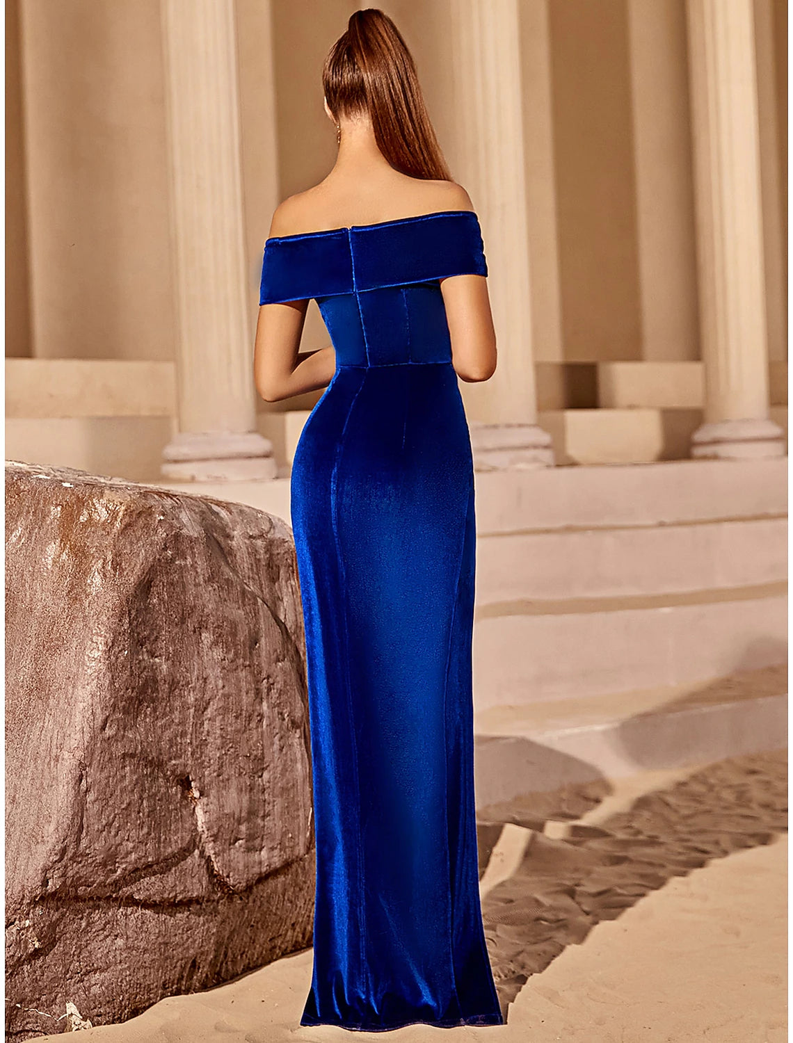 Elegant blue velvet off-shoulder party dress.