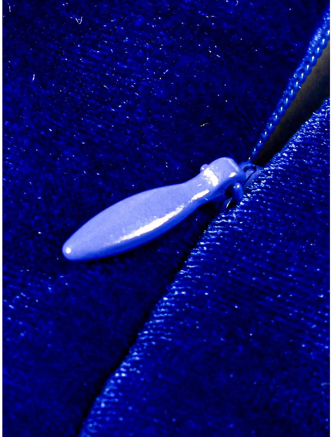 Ruched slit detail on blue velvet sheath dress.