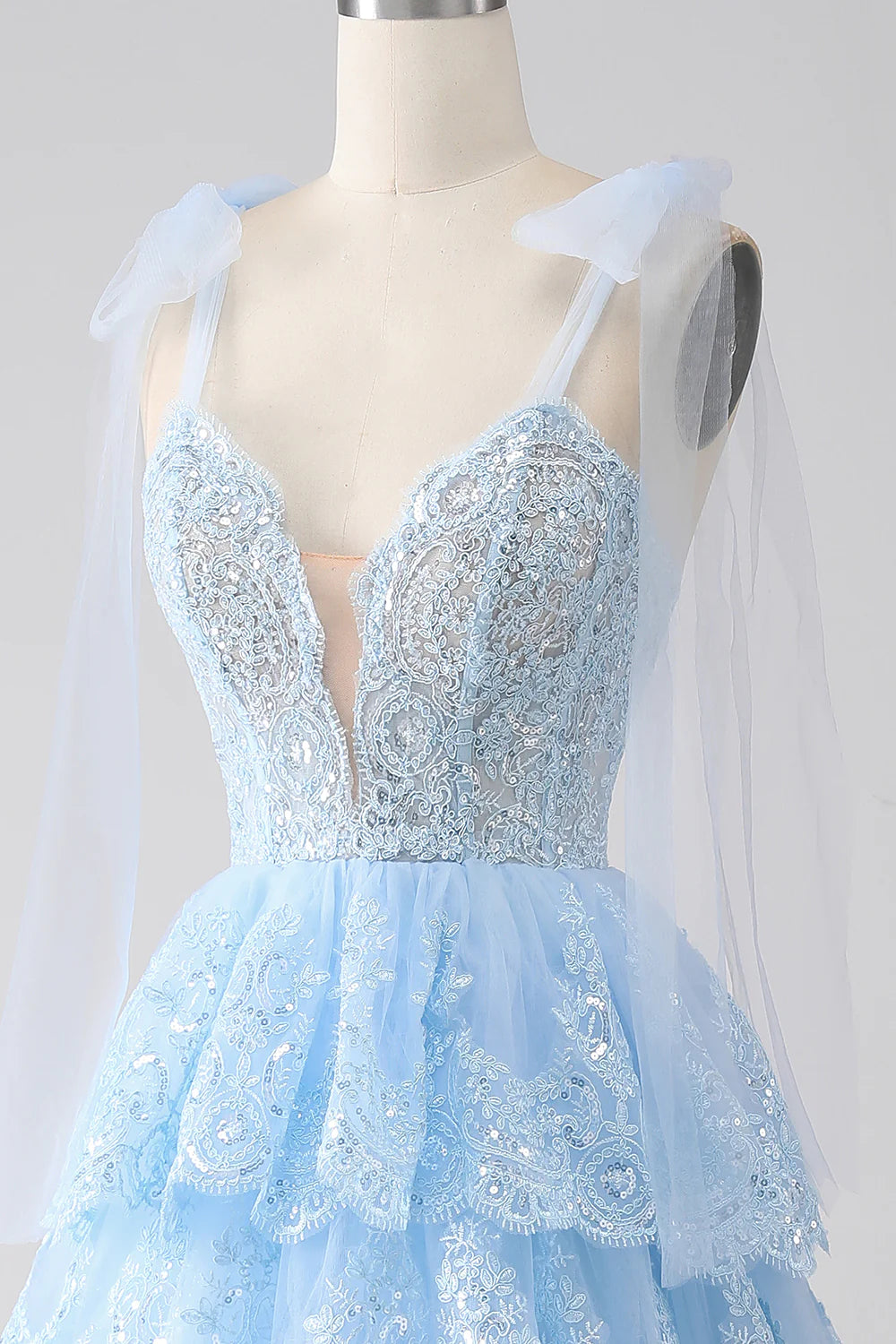 Wholesa Light Blue Sweetheart Bow Tie Straps Tiered Tulle Sequin Prom Dress with Appliques